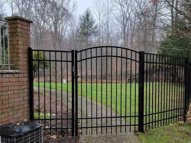 Flat-top aluminum picket fence in a NJ backyard