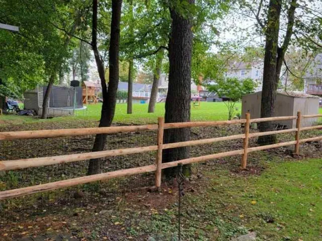 Custom wood fence with decorative top in a NJ backyard