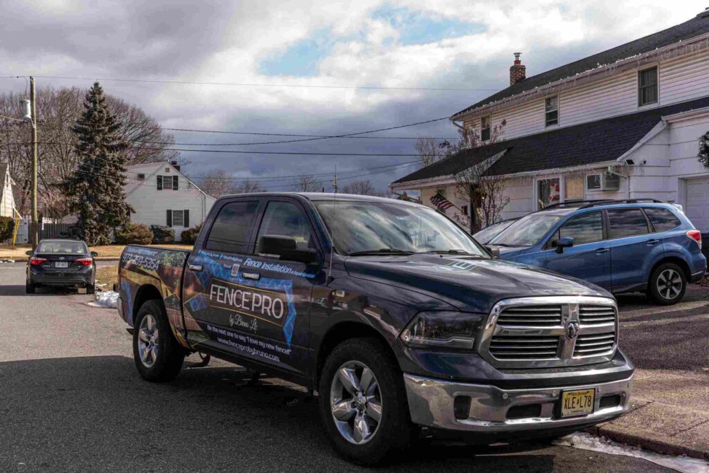 Fence Pro by Bruno branded pickup truck at a residential install