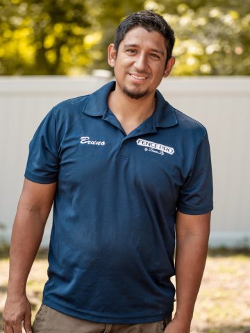 Bruno Facundo, owner of Fence Pro by Bruno, wearing the company polo