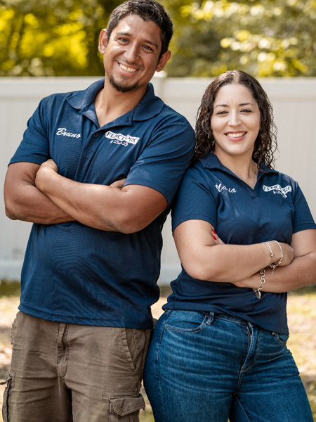 Bruno Facundo and Maria Camacho, owners of Fence Pro by Bruno, in branded company polos
