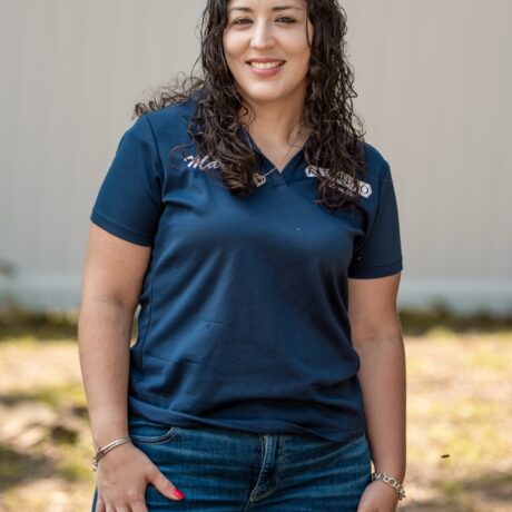 Maria Camacho, co-owner and project coordinator at Fence Pro by Bruno, wearing the company polo